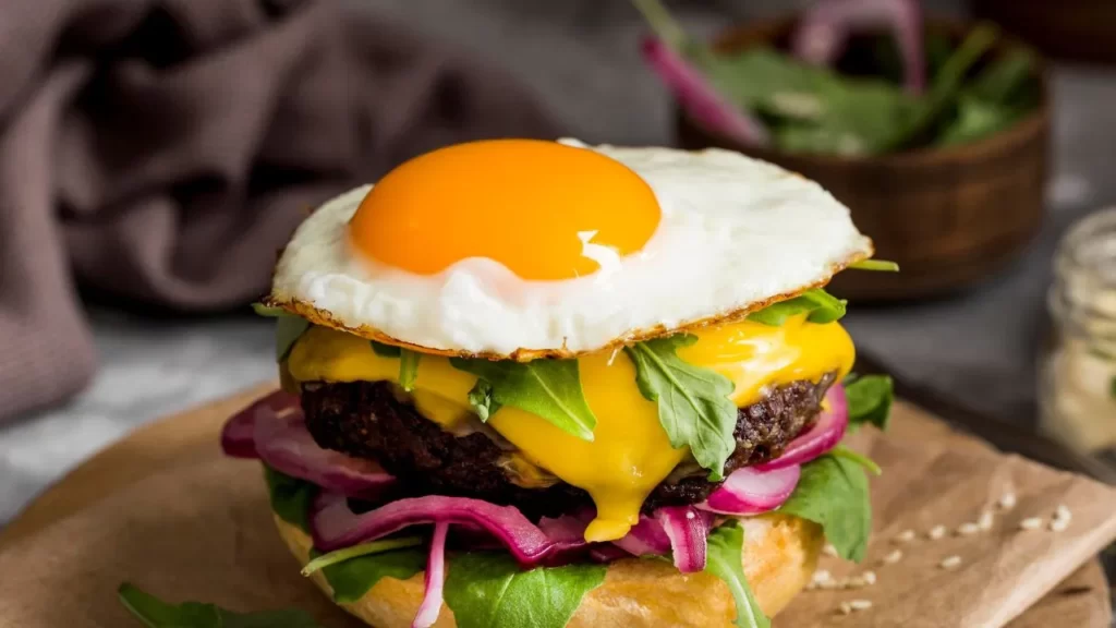 A tasty twist of burger with egg on it

